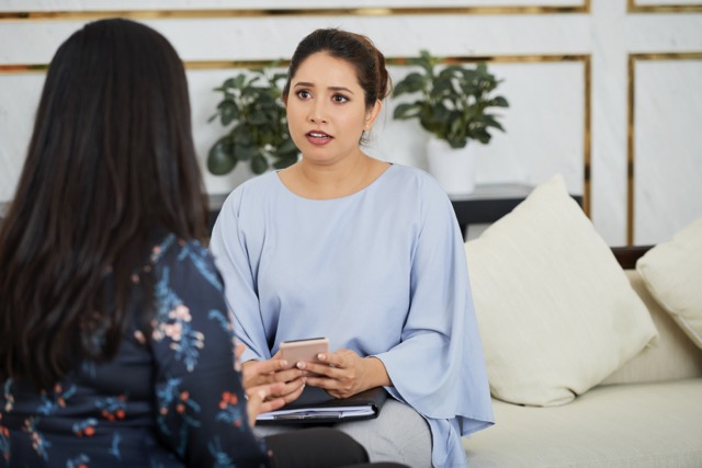 An educator listens actively to a concerned parent.