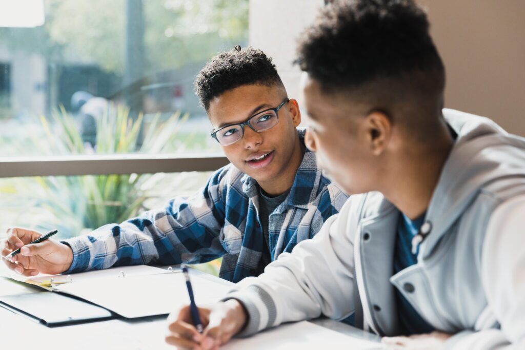 Two middle school students study together for a test.